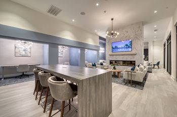 Resident e-lounge with coffee bar, game room & coworking stations